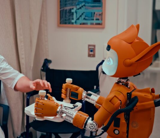“집에서 시작하는 AI 건강 관리, 일상에 똑똑하게 스며든다” Man gives robot bottles on a tray