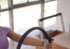 MZ세대부터 중장년층까지… 필라테스로 활기찬 일상 가꾸기 a woman sitting on the floor holding a steering wheel